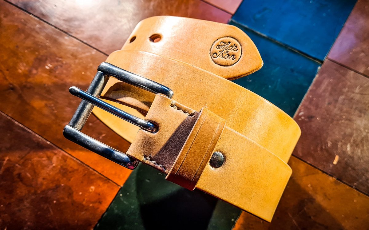 Tan leather belt with silver buckle